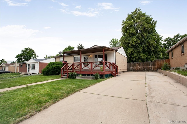 7839 Florado St, Denver, CO 80221 - view of front facade featuring a porch and concrete driveway