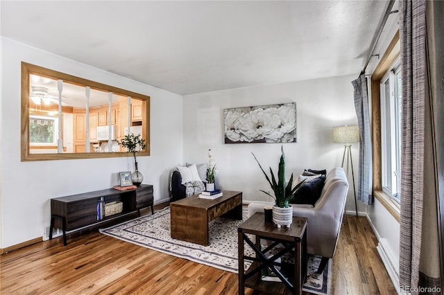 7839 Florado St, Denver, CO 80221 - living area featuring wood finished floors and baseboards