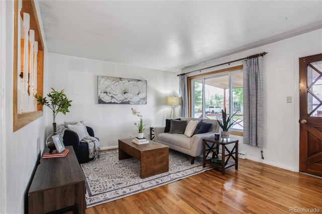 7839 Florado St, Denver, CO 80221 - living room featuring wood finished floors and baseboards