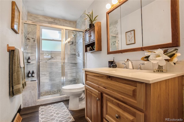 7839 Florado St, Denver, CO 80221 - full bathroom with vanity, a stall shower, and wood finished floors