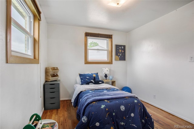 7839 Florado St, Denver, CO 80221 - bedroom featuring wood finished floors