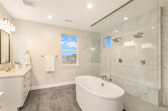 bathroom with vanity, plus walk in shower, and tile patterned floors