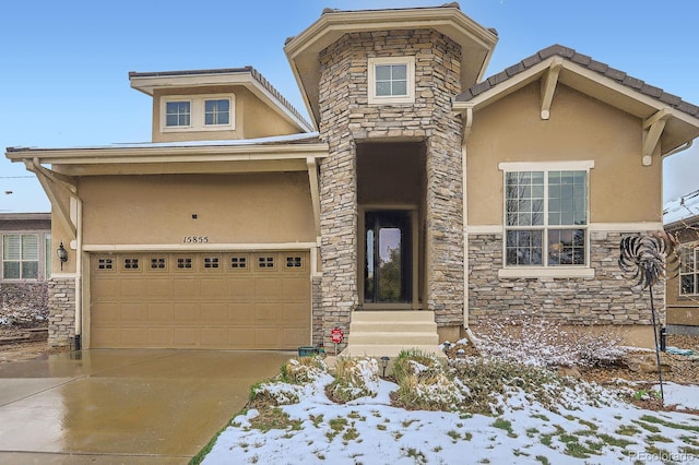 15855 Wild Horse Dr, Broomfield, CO 80023 - view of front of property with entry steps, driveway, stone siding, and stucco siding
