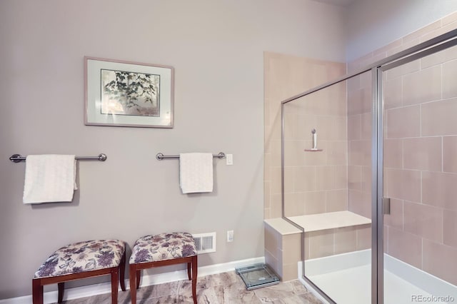 15855 Wild Horse Dr, Broomfield, CO 80023 - bathroom with visible vents, baseboards, and a stall shower