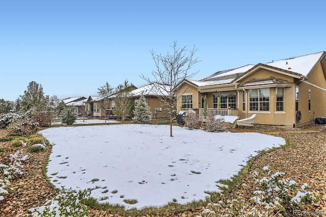 15855 Wild Horse Dr, Broomfield, CO 80023 - snow covered back of property featuring stucco siding