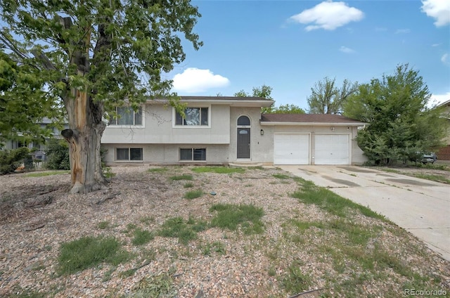 196 Jersey, Colorado Springs, CO 80911 - tri-level home with an attached garage and concrete driveway