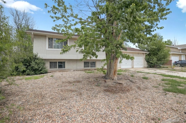 196 Jersey, Colorado Springs, CO 80911 - tri-level home with a garage and concrete driveway