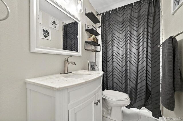 196 Jersey, Colorado Springs, CO 80911 - bathroom featuring vanity, toilet, marble finish floors, and a shower with curtain