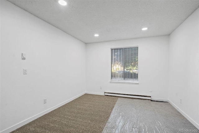 empty room featuring a baseboard radiator, a textured ceiling, and carpet floors