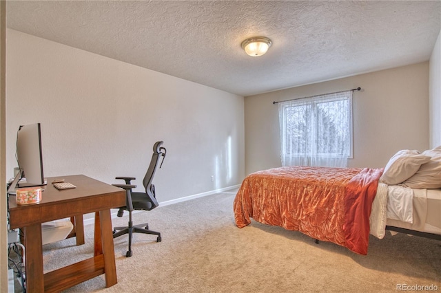 carpeted bedroom with a textured ceiling