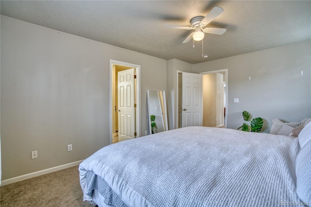 bedroom with light colored carpet, a textured ceiling, and ceiling fan