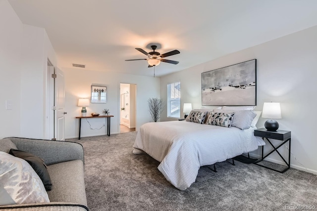 bedroom featuring ceiling fan, carpet floors, and ensuite bath