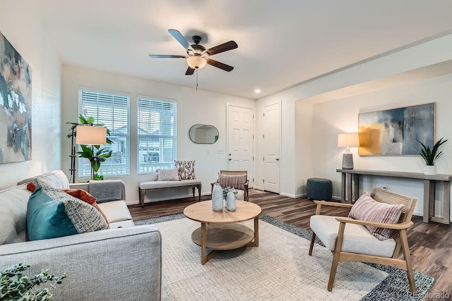 living room featuring hardwood / wood-style flooring and ceiling fan