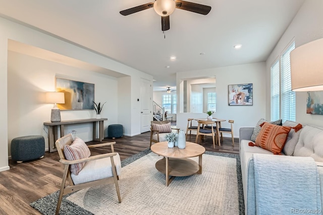 living room with ceiling fan and hardwood / wood-style floors