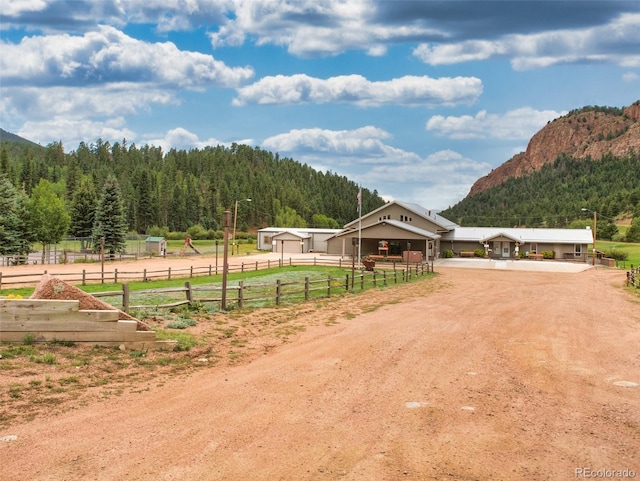 surrounding community with a mountain view and a rural view