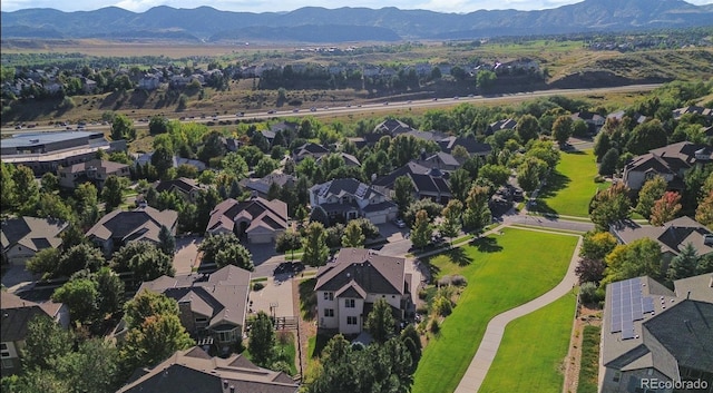 birds eye view of property with a mountain view