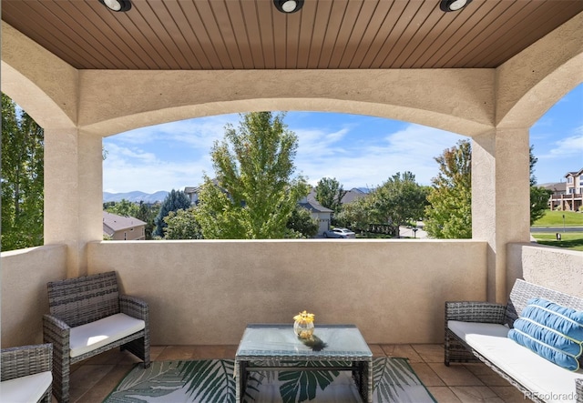 10215 W Wesley Dr, Lakewood, CO 80227 - view of patio featuring a balcony and a mountain view