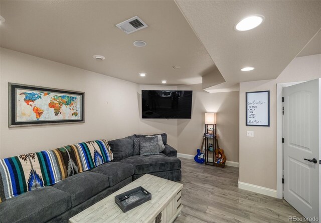 living room with light hardwood / wood-style floors