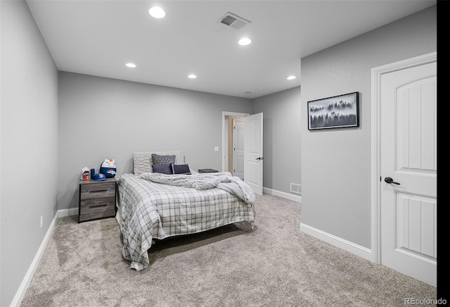 bedroom featuring light colored carpet