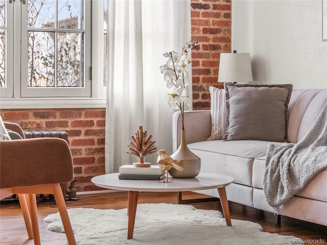 living area featuring a healthy amount of sunlight and hardwood / wood-style floors