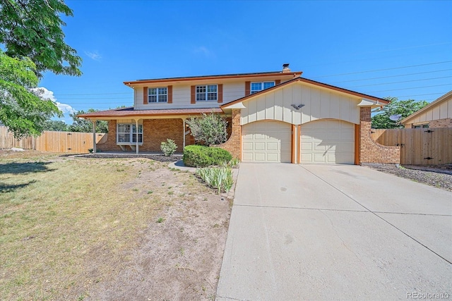 1923 S Newark Way, Aurora, CO 80014 - view of front of property with a garage, brick siding, and concrete driveway