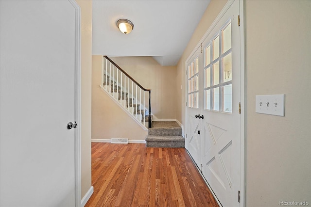 1923 S Newark Way, Aurora, CO 80014 - foyer entrance featuring wood finished floors and stairs