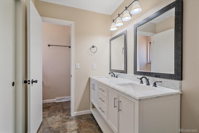 1923 S Newark Way, Aurora, CO 80014 - full bathroom with double vanity and stone finish flooring