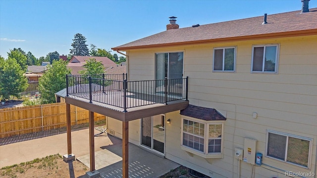 1923 S Newark Way, Aurora, CO 80014 - back of property with a patio and a chimney