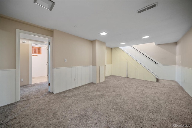 1923 S Newark Way, Aurora, CO 80014 - finished basement featuring carpet flooring, wainscoting, and stairway