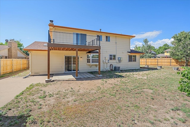 1923 S Newark Way, Aurora, CO 80014 - rear view of house featuring a fenced backyard, a patio, and a balcony