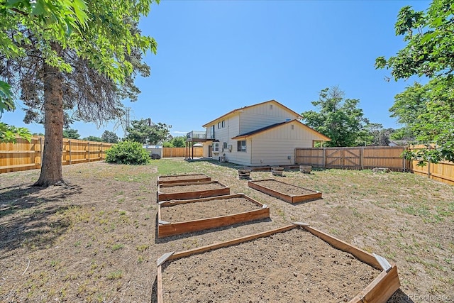 1923 S Newark Way, Aurora, CO 80014 - fenced backyard with a vegetable garden
