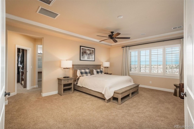 bedroom featuring carpet floors, ornamental molding, visible vents, and baseboards