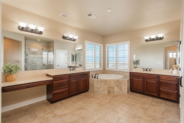 full bathroom featuring a stall shower, a sink, and visible vents