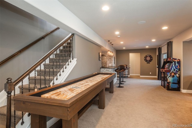 rec room featuring recessed lighting, light colored carpet, and baseboards