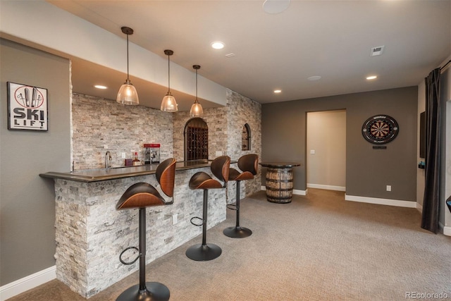 bar featuring carpet, indoor wet bar, recessed lighting, visible vents, and baseboards