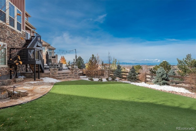 view of yard with stairs and a patio area