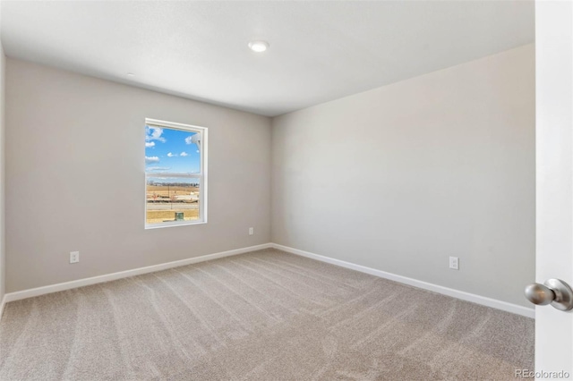 unfurnished room featuring carpet