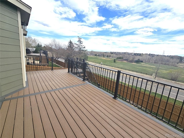 wooden deck featuring a rural view