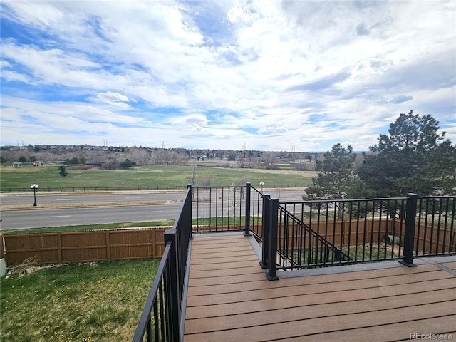 wooden deck featuring a rural view