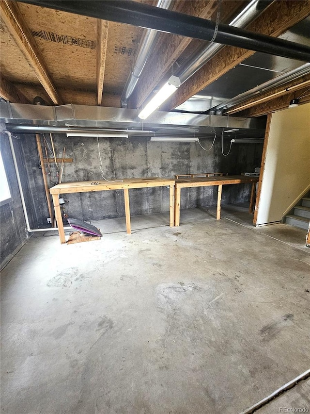 unfinished basement with stairs