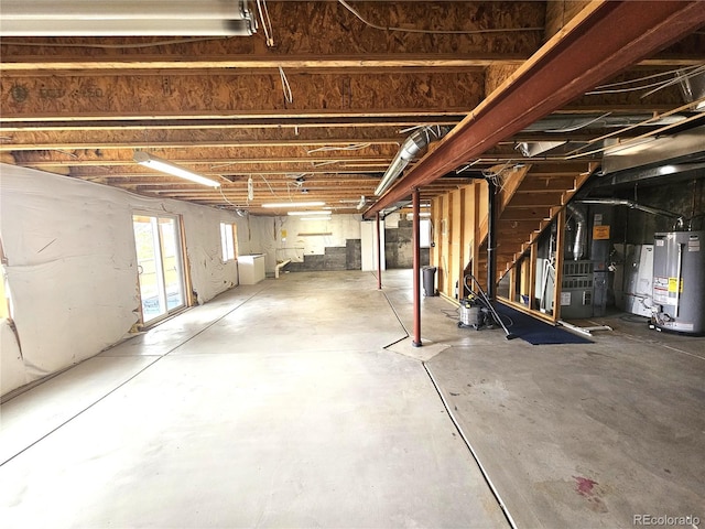 basement with water heater, stairway, and heating unit