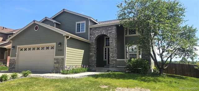 21580 Longs Peak Ln, Parker, CO 80138 - view of front of property featuring stone siding and an attached garage