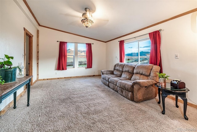 carpeted living room with ceiling fan, ornamental molding, and lofted ceiling