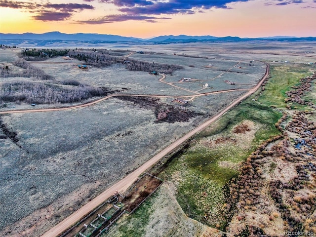 aerial view at dusk with a mountain view