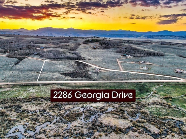 aerial view at dusk with a mountain view