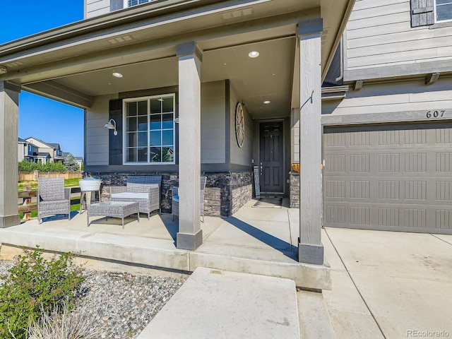 607 Azalea St, Brighton, CO 80601 - doorway to property with covered porch, a garage, and stone siding