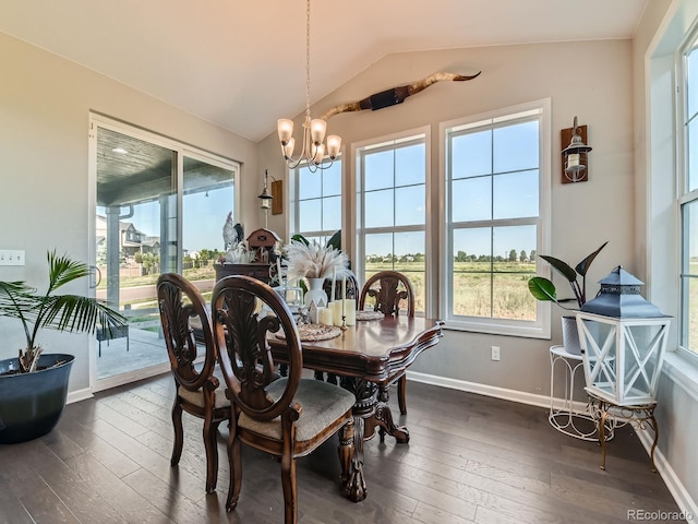 607 Azalea St, Brighton, CO 80601 - dining area featuring a chandelier, dark wood finished floors, and vaulted ceiling