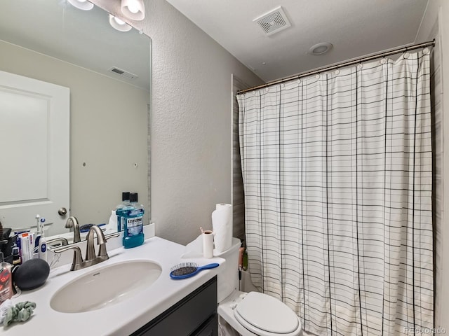 607 Azalea St, Brighton, CO 80601 - full bath featuring vanity, curtained shower, and a textured wall