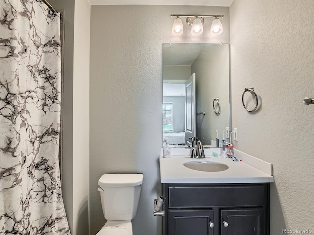 607 Azalea St, Brighton, CO 80601 - bathroom with vanity, a shower with shower curtain, and a textured wall