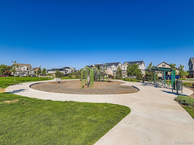 607 Azalea St, Brighton, CO 80601 - communal playground with a lawn and a residential view
